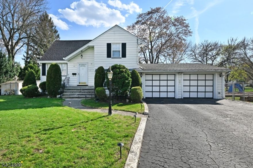 This expanded 3-4 bedroom, 1.5 bath Tri-Level Split offers approximately 2,164 sq ft of flexible, multi-level living on an oversized 98.41x122.29x92.5x122.43 lot. The property backs to the elementary school playfield, providing a wide, open, park-like view. The entry foyer with two coat closets leads to a spacious Formal Living Room and an open-concept MEIK and Dining Room with sliders to a large deck. Second floor has two generous bedrooms and a full bath (SOT) with newly refreshed shower grout. Third floor private Primary Suite.Ground level offers entry from the 2-car garage, powder room, laundry room with sink, and an office/media room/optional 4th Bedroom (15'3" x 11'9"). A bonus family room addition (23'6" x 11'5") offers direct access to the yard. A large finished basement provides additional recreation or storage space. Additional features include central air, sprinkler system, whole-house generator, security system, recessed lighting, ceiling fans, and dimmer controls throughout. The home has no known issues but is being sold as-is, including driveway and deck.Conveniently located near the elementary school and close to shopping, houses of worship, major highways, and more.