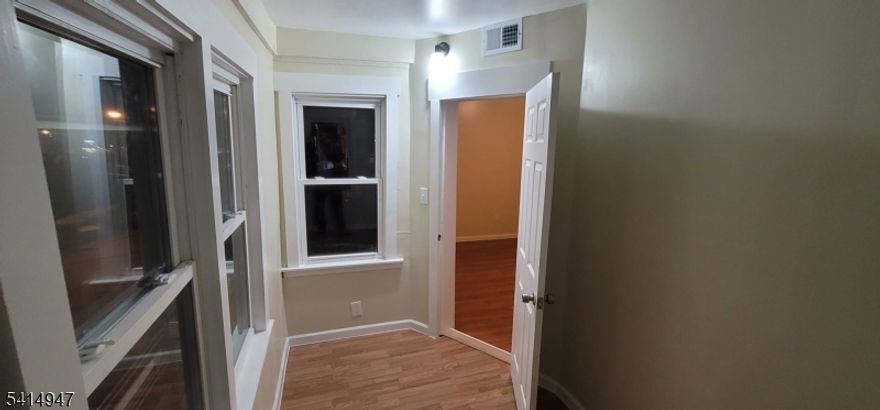 Welcome to this beautifully renovated and well-maintained second-floor apartment located at 373 South 18th Streetin Newark, NJ. This spacious three-bedroom home features a large master bedroom with a walk-in closet, plus aversatile bonus room that can be used as a home office, or additional living space. The apartment offers abright and functional layout, washer and dryer hookups for added convenience, and access to a shared backyardperfect for outdoor enjoyment. Ideally situated near West Side Park and the Boylan Street Recreation Center with itspublic pool and recreational facilities, this home also provides easy access to Interstate 280 and the Garden StateParkway, making commuting simple and convenient. Close to shopping, schools, and public transportation, thisapartment offers the perfect blend of space, comfort, and location.