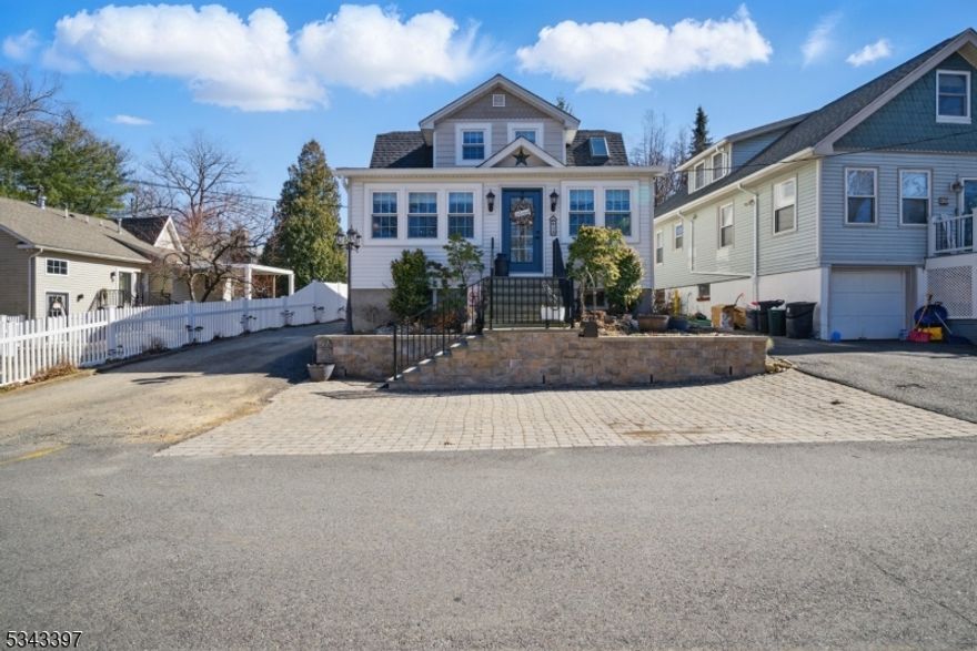 Pristine, Updated and Charming Indian Lake Cape with seasonal Lake views. Lovely features give this home a cottage feel, including; hardwood floors, custom moldings, unique fixtures, built-ins, stained glass, rustic ship lap, finishes, etc. Lake living at its best! A sun room with higher ceilings welcomes you in. Large living room with a stone faced, gas fireplace. Versatile floor plan, functional granite kitchen w/center island & SS appliances. Formal dining room. Terrific sunny lot enjoyed through lots of newer windows, to enjoy. 1st floor office w/french doors, a cozy den & a full bath w/stall shower. Upstairs features 3 bedrooms, including the primary with ample closet space & the second full bath w/ tub shower. The full basement provides lots of storage & laundry. Small finished space for a 2nd office or sitting room! If the house isn't perfect enough, you will fall in love with the beautiful deck & fenced in yard! Mudroom, transitions you out.. Lovely paver patios, gardens and hot tub to enjoy year round! Detached one car garage. Tons of parking! Tremendous curb appeal! Located just steps from the Indian Lake clubhouse, which offers (with membership) 3 beaches, clubhouse, bar & year-round activities for all ages. Motor boats allowed! Only a few minutes drive to Downtown Denville, NYC Midtown Direct train/bus & easy access to Rt 80, 10, 46, 287. Great school systems. Water heater only 2 years old. Roof only 4 years old.