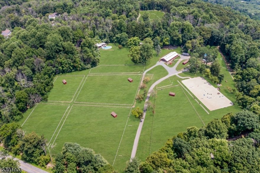 HORSE FARM PROPERTY! Welcome to the magnificent Mountain View Farm situated on 22.5 ACRES! Amazing opportunity for professional trainer or amateur equestrian - currently used as eventing training center w/ hunter/jumper & dressage amenities. Center aisle horse barn w/ 10 stalls features: wash stall w/ hot/cold water, feed room, trainer tack room, additional tack room & outdoor grooming stall. Bonus 4 stall Amish built shed row barn & 2 separate storage sheds. Professionally installed 200 x 100 OUTDOOR ARENA w/ state of the art fiber blend footing. Lush fenced paddocks & pastures. Perimeter cross country course & gallop plus mountain top flat grass field. Custom 4 BED, 3 BATH CONTEMPORARY HOME is refreshingly bright & airy, trendy yet modern living. Open concept space combines the LR w/ wood burning fireplace, dining area, gourmet kitchen & sun room w/ floor to ceiling windows. 1st floor includes: oversized primary bedroom suite; 3 additional bedrooms & 3 full baths. Lower level features cozy FR plus unfinished storage & utility space. Relax outdoors amongst the varying entertaining spaces which include bluestone patio w/ pergola, deck & terraces overlooking the equestrian elements. INGROUND POOL; POOL HOUSE which includes a LR area w/ kitchenette, changing area w/full bath w/ shower & guest room suite. Det. 2 car garage. Nature trails & wooded paths. FARM ASSESSED. Commuter access to greater Manhattan/NYC. Experience the pure charm & tranquility of this enchanting horse farm!