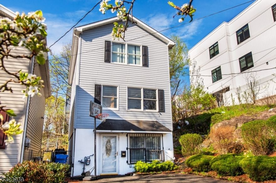 Multiple offers received. Seller is requesting highest and best offers by Wednesday, 4/22 at 8:00 PM..This recently renovated single family home offers 3 bedrooms and 2 baths across three levels of living space. The layout features a spacious living room, eat-in kitchen, recreation room, and an additional bonus room perfect for a home office, guest space, or additional living area and a dedicated laundry room. Conveniently located near NJ Transit bus and train lines, major highways, and Paterson's vibrant downtown, this home offers easy access to shopping, dining, and commuting options. Enjoy the added benefit of off-street parking. A true gem offering space, versatility, and convenience!