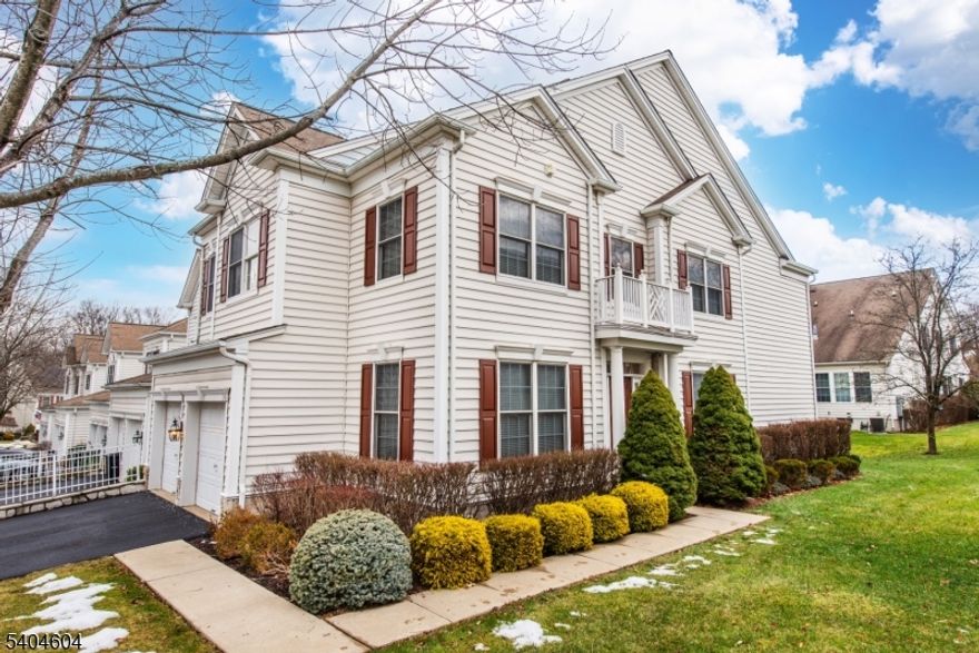 Spacious and sun-filled end-unit Hemswell Model townhome offering approximately 4,120 sq ft including the fully finished basement. Features 3 bedrooms and 3.5 baths with a two-story entry foyer, crown molding throughout, and hardwood flooring on the first and second levels. Main level includes office/den, living room, formal dining room, family room with fireplace, and eat-in kitchen with granite countertops, stainless steel appliances, breakfast bar, and access to a private outdoor terrace. Second level offers a primary suite with sitting area, fireplace, tray ceiling, walk-in closet, and en-suite bath with jetted tub, stall shower, and double vanity, plus two additional bedrooms, full bath, and laundry. Finished basement includes full bath, recreation room, study, entertainment room, and storage. Two-car garage plus additional parking. Located in the desirable, private, gated community of Hickory Hill with 24-hour security and amenities including outdoor heated pool, clubhouse, and exercise room. Excellent location with NYC bus at corner, minutes to train, shopping, and restaurants. Near major highways and golf course.