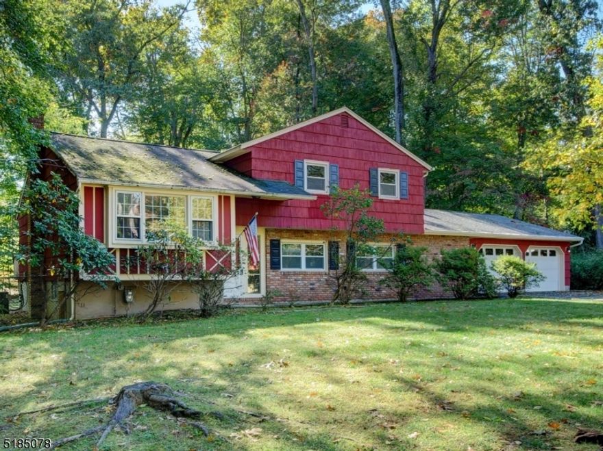 SITUATED ON CLOSE TO ONE ACRE OF PARK-LIKE PROPERTY ON A DESIRABLE TREE-LINED STREET, THIS 3 BEDROOM, 1 & 1/2 BATH SPLIT HOME IS READY FOR YOUR FINISHING TOUCHES.  LIVING ROOM, FORMAL DINING ROOM WITH OPEN FLOW. EXTRA LARGE ENTERTAINMENT STYLE GREAT ROOM WITH WOOD BURNING FIREPLACE AND FULL WET BAR. WOOD FLOORS IN BEDROOMS, HALLWAY, LIVING & DINING ROOM.  GREAT ROOM, OVERSIZED TWO CAR GARAGE,  AND HALF OF THE ROOF REPLACED APPROXIMATELY 3 YEARS AGO.   NEWER WINDOWS THROUGHOUT. THE LARGE, LEVELED BACKYARD FEATURES A PATIO, DECK AND STORAGE SHED. ESTATE SALE BEING SOLD AS IS. FULL BASEMENT WITH LAUNDRY READY FOR UPDATING. ALL PUBLIC UTILITIES. CONVENIENTLY LOCATED MINUTES TO PARK & RIDE AND NJ TRANSIT TRAINS TO NYC, BEAUTIFUL MORRIS COUNTY PARKS & LAKES, HIKING, BIKING, SCHOOLS AND MUCH MORE! (Some photos virtually staged).