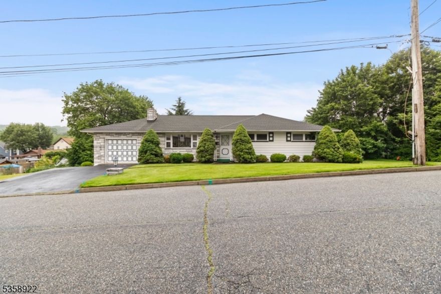 Introducing this charming ranch-style home in the heart of Netcong, ideally located just minutes from Route 80 and the scenic shores of Lake Hopatcong. Hitting the market for the very first time, this spacious gem sits on a rare double lot and offers the ease of one-floor living with hardwood flooring hidden beneath the carpets. Featuring 4 bedrooms and 2 full bathrooms, the home includes a finished basement with a private entrance perfect as an in-law suite or guest space. Enjoy a brand-new roof, a one-car garage, and a private backyard complete with a patio that's ideal for relaxing or entertaining. A true hidden gem with endless potential in a prime location.