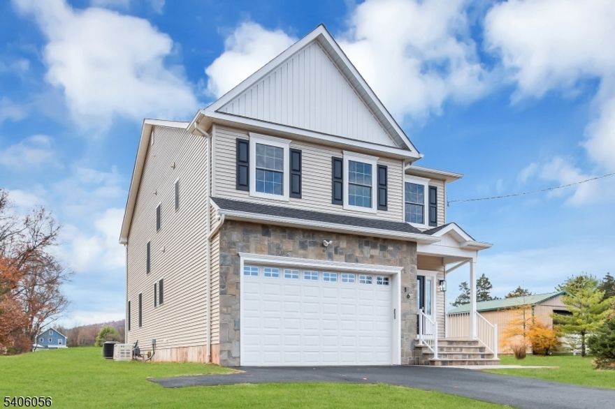 A rare opportunity for brand-new construction in the heart of Whitehouse Station. Set within prestigious Readington Township and just minutes from Route 78, this ground-up new build blends modern design, quality craftsmanship, and everyday convenience. Step inside to spacious 9-foot ceilings, wide-plank hardwood floors, and sun-filled spaces that create an effortless flow for living and entertaining. The open-concept kitchen anchors the home with quartz countertops and an oversized center island, seamlessly connecting to the living and dining areas. Upstairs, the primary suite offers a quiet retreat with a tray ceiling, walk-in closet, and spa-inspired bath. Three additional bedrooms provide generous space and flexibility. An 18-kilowatt whole-house generator and a 10-year home warranty add comfort and peace of mind. Select photos are virtually staged to highlight scale and potential. Brand new construction, beautifully finished and built to last.