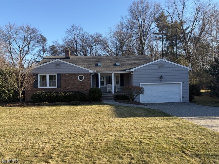 Deceivingly spacious with undeniable curb appeal, this lovely home rests on .44 acres of flat, private property in the coveted Hill Section, offering the perfect blend of charm, comfort, and flexibility. From the moment you arrive, the inviting front porch ideal for enjoying sunsets sets the tone. Inside an open floor plan unfolds, with gleaming wood floors and effortless flow perfectly designed for today's lifestyle. The kitchen features cream cabinetry, stainless steel appliances, and a breakfast bar that opens to the dining area and family room with vaulted ceiling, creating a connected space perfect for everyday living and entertaining.The lower level is expansive, offering an enormous recreation room with peaceful views of the yard and direct access to a newer sunroom with cathedral ceilings and three walls of windows. This level ideal for an in-law suite also includes a bedroom or office, a full bath, and a versatile laundry room complete with sink, dishwasher, small refrigerator, and ample space for arts and crafts.The second level features three large bedrooms and two full baths, including a private primary suite with an ensuite bath and two closets, one a walk-in. The beautifully landscaped yard offers privacy and lots of space to play, relax or entertain, with paver patio, shed, a two car garage, paver driveway and additional parking for two cars. Many updates include exterior front stairs and columns, washer and dryer, hot water heater, central air, and many more.