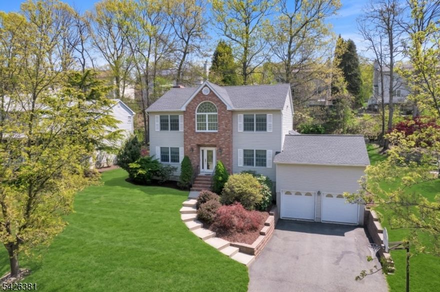 Welcome to this charming 4-bedroom, 2.5-bath Colonial nestled in one of the area's most desirable neighborhoods where tree-lined streets set the scene and you can still ride bikes and play outside. This warm and inviting home offers the perfect blend of comfort, space, and timeless appeal. Step inside to a spacious living room filled with natural light, alongside a formal dining room ideal for hosting gatherings and special occasions. The eat-in kitchen features granite countertops, a center island, and plenty of room for everyday meals or entertaining. Just off the kitchen, the cozy great room with a fireplace creates the perfect spot to relax and unwind. Extend your living space into the bright three-season room, complete with sliders that open to a deck overlooking a private backyard perfect for morning coffee, summer barbecues, or quiet evenings outdoors. With generous bedrooms, thoughtful layout, and a location that offers both community charm and convenience, this home is a rare opportunity you won't want to miss.