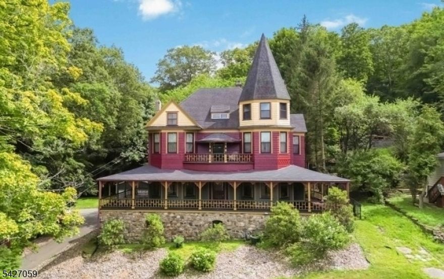 Spectacular Queen Anne Victorian w/Seasonal Panoramic Lake Views Minutes to Lake Hopatcong! Step into timeless elegance with this one-of-a-kind Victorian known as the historic William Arnott House. This architecturally significant home offers a perfect blend of original charm and modern updates. The grand wrap-around porch welcomes you into a gracious entry foyer and exquisite grand oak staircase and fireplace. The formal living and dining rooms both feature dramatic floor-to-ceiling windows and beautiful fireplaces, creating a warm and inviting atmosphere. The beautifully renovated kitchen features a center island, breakfast bar, coffee station, stainless appliances, and a picturesque window overlooking the private backyard. The 2nd floor offers a primary suite complete with an original fireplace, walk-in closet, ensuite bath featuring a walk-in shower and classic clawfoot soaking tub. Two additional spacious bedrooms, full bath and Juliet Balcony complete this level. The 3rd floor provides exceptional versatility w/3 bedrooms, a full bath, a bonus rm and a large storage rm. Outdoors, the fenced yard is an entertainer's paradise with 2 patios, gorgeous inground pool, hardscaping and landscaping, plus detached 2 car garage. This extraordinary home has been lovingly maintained and thoughtfully updated, offering historical character w/modern amenities. Located walking distance to Lake Hopatcong beaches, parks, downtown Mount Arlington this is more than a home, it's a lifestyle!