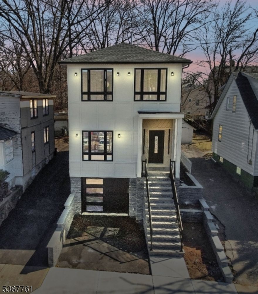 Almost a 100% new construction, rebuilt all the way down to the sewer line to the street?but without the new-construction price tag! Located in the desirable Vauxhall section, this redesigned gem offers 3 bedrooms, 2.5 baths, and a compact two-car garage. Step inside to 9-ft ceilings, expansive windows, and an airy layout filled with sunlight. Enjoy a modern kitchen with 36-inch cabinetry, quartz counters, and stainless steel appliances paired with beautiful hardwood floors throughout. The primary suite features its own private bath and ample closets. High-efficiency mechanicals and premium insulation add excellent comfort and value. Minutes from Millburn and Maplewood train stations, major highways, shopping, dining, and Newark Airport. With the new reassessed tax rate and LOW TAXES, this one is a steal in a prime location!