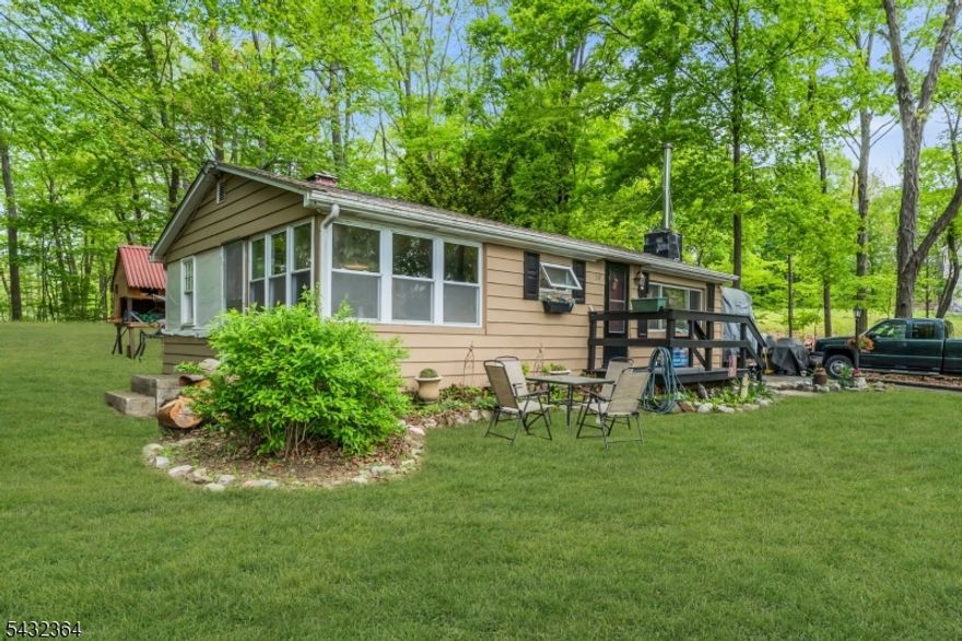 Welcome to the beautiful lake community of Crandon Lakes and discover the perfect ranch-style retreat! Whether you're searching for an affordable first home, weekend getaway, or peaceful year-round residence, this move-in ready home offers comfort, charm, and low taxes in a quiet private lake setting. Thoughtfully updated throughout, this home features a roof approximately 5 years old, a septic system installed in 2007, and a newer split-unit system providing efficient heating and air conditioning. The fireplace was professionally cleaned in 2025, and newer appliances including the refrigerator, dishwasher, washer, and dryer are all included with the sale. Interior improvements include new sheetrock ceilings, custom wood trim, along with newer luxury vinyl plank flooring throughout the kitchen, dining room, and living room. The spacious kitchen offers a center island with beautiful butcher block countertops and a built-in cooktop, perfect for entertaining or everyday living. Enjoy everything Crandon Lakes has to offer with incredible community amenities including two private beaches, picnic areas, playgrounds, a community garden center, soccer and basketball courts, boating, kayaking, fishing, and live music weekends from Memorial Day through Labor Day.Come experience stress-free lake living and make this summer your best one yet!