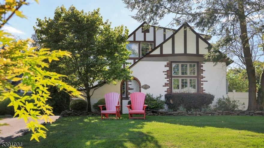 Cool neutrals and timeless design elevate this beautifully renovated Cotswold Tudor, nestled on a lush and private .31-acre lot in Westfield?s coveted Gardens section. Surrounded by mature perennial plantings, the home?s storybook curb appeal is enhanced by a charming portico and manicured landscaping. Located just minutes from downtown, top-rated schools, and convenient NYC-bound transportation, this residence offers an unbeatable blend of charm and accessibility.Inside, a welcoming den sets the tone with classic architectural details, opening to a living room with hardwood floors and a wood-burning fireplace. The dining room comfortably seats eight, flowing seamlessly into an open kitchen featuring crisp white cabinetry, a center island, farmhouse sink, and stainless steel appliances. A vaulted family room with a marble fireplace and French doors opens to the tranquil backyard. The first floor also includes a bedroom with an en-suite bath and dedicated laundry, plus dual mudrooms from both the side and rear entrances.Upstairs, the oversized primary suite impresses with a large walk-in closet and spa-like bath complete with soaking tub, walk-in shower, and dual vanities. Three additional bedrooms and two full baths complete the second floor, offering generous space for every need. With its refined style, thoughtful layout, and prime location, this move-in ready gem offers an exceptional opportunity in one of Westfield?s most desirable neighborhoods.