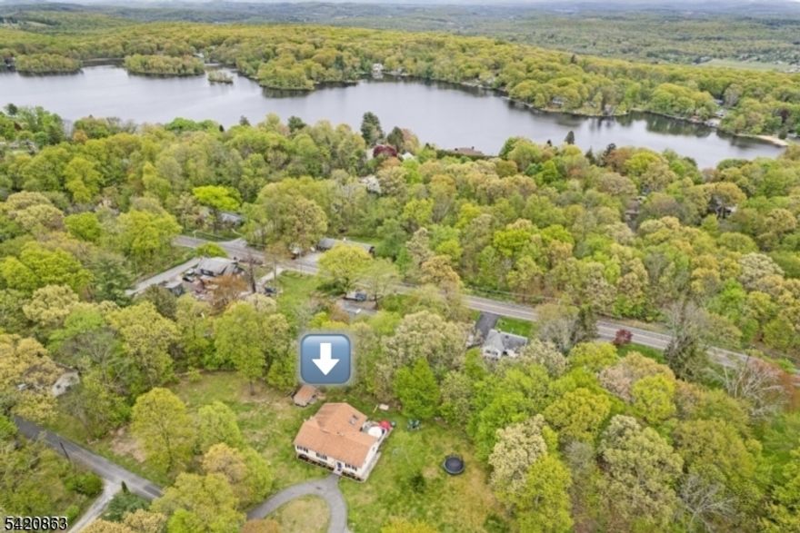 Welcome to your dream home at 4 Grove St, Hampton Township, NJ 07860 - Lake Kemah Community.  This stunning 5-bedroom, 3-full-bath bi-level home offers over 1 acre of lush land (approx. 1.72 acres based on specific records). 5 generous bedrooms and 3 full baths, providing ample space for family and guests. Features a family rec room, a dedicated office space for remote work, a playroom, and a workshop, can also easily become an in-law suite.Farmhouse Kitchen: Bright and functional kitchen opening to a spacious great room, perfect for entertaining.Indoor-Outdoor Flow: Step out from the main living area onto a large deck overlooking the private backyard.Updated Comfort: New septic system installed 4 years ago,( 4 Bd town verified)  along with numerous modern updates throughout.Location/Community: Located in a quiet cul-de-sac a short walk/drive to the desirable Lake Kemah , offering tranquil living and lake privileges.This meticulously maintained property in Sussex County combines comfort, functionality, and nature. Don't miss this opportunity to own a piece of paradise in Hampton Township!