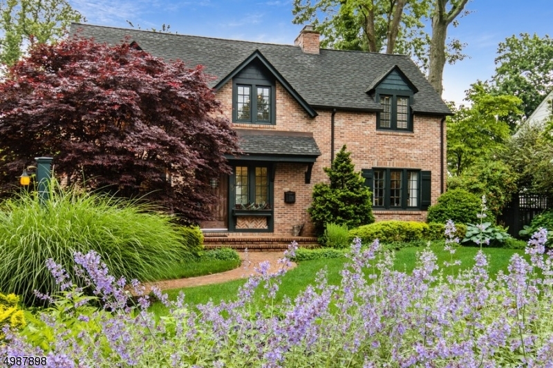 Beautifully renovated 1938 custom colonial architectural plans from the renowned "David Rosen" Group.  This house was newly built from top to bottom.  Close to town, train and schools. 2 tiered patio overlooking a "Secret" Garden landscaped for total privacy and low maintenance.  Newly renovated powder room and stainless steel appliances in the custom kitchen.