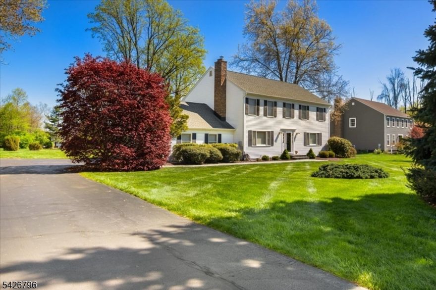 Meticulously maintained by the original owners, this pristine 4-bedroom, 2.5-bath home sits on a FLAT nearly ON ACRE of beautifully kept property. Pride of ownership is evident throughout, with thoughtful updates completed over the years, including a RENOVATED KITCHEN featuring updated cabinetry, appliances, and granite countertops, as well as NEWER primary and half baths! Major improvements over the years such as the ROOF, FURNACE AND CENTRAL AIR SYSTEM provide added value and peace of mind, along with the convenience of a WHOLE-HOUSE GENERATOR! The home offers generously sized rooms, HARDWOOD FLOORING throughout, and a neutral, move-in-ready interior that provides a versatile backdrop for a variety of design styles. A whole house attic fan and multi-zone heating.  A pristine unfinished basement provides excellent storage and presents endless potential for future finishing. Set on a spacious, level property, the exterior features a beautifully landscaped yard, A DECK ideal for outdoor entertaining, and a TWO-CAR ATTACHED GARAGE. This home combines comfort, functionality, and long-term value truly a standout opportunity! Located short distance from Mt Olives top tier schools as well as convenience to major thoroughfares. Shelving on living room walls will be included.