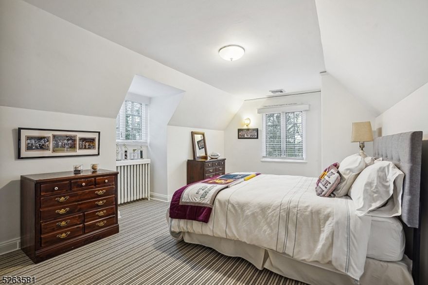 Totally renovated English Country Colonial on a wonderful tree lined street, summer cutting garden, in-ground sprinkler system, slate roof,  partially fenced yard, two private bluestone patios, all new custom windows throughout, newer CAC,exceptionally bright rooms with many windows, laundry on the second floor, newly updated eat-in kitchen, large formal dining room, gas burning fireplace, California closet, newly finished wood floors, new carpeting, highend chandeliers, custom shelving, new HWH, new garage doors and opener.  Kitchen and all baths have been renovated. Gas fireplace "as is" with no known defects.