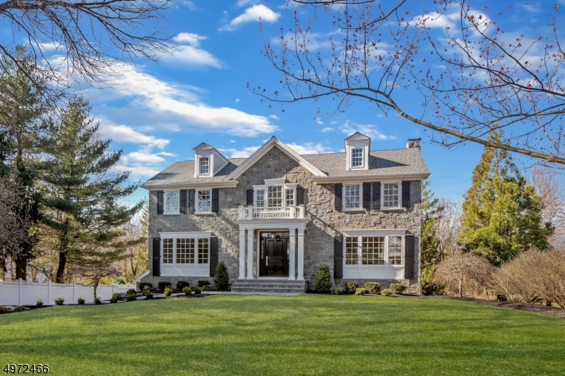 Stunning renovation of 6 BR /5.1 BA Colonial nestled in the heart of desirable Wickham Woods.  This one-of-a kind home will exceed the expectations of even the most discerning buyer. Open floor plan w/ custom features including extensive trim package thru-out. Chef's gourmet kitchen features white cabinetry, Thermador appliances, large center island, wet bar w/ beverage fridge, large walk-in pantry. 1st floor bedroom w/full bath, gas FP in FR and office, wide-plank oak floors, formal LR & large DR complete the 1st floor.  2nd floor includes dream master suite w/gas FP, sitting room, 2 closets and luxurious bath with barrel-vaulted, lighted ceiling. 3 add'l BR's & laundry complete this level.  Finished walk-out LL w/mudroom, rec room, bedroom & full bath.  Too many features & upgrades to list.