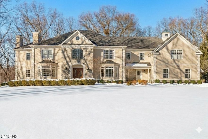 This stately 5 bedroom/5.2 bath Collie Mannion Custom home offers a substantial living space suited for those prioritizing craftsmanship, privacy & long-term utility. At approximately 7300 sqft, this home, set on 5.46 acres on a quiet cul-de-sac, provides a retreat-like setting in a prime Roxiticus Valley neighborhood. A grand 2-story foyer introduces a floor plan organized around generous rooms, high ceilings & natural light. The 18-ft-high great room w/ floor to ceiling stone FP & adjacent mahogany office offer a balance between work & home life, supported by well-scaled gathering areas & a recently updated bar/sun room w/ custom built mahogany Subzero wine fridge, designed for entertaining w/ ease. The kitchen & oversized breakfast room boast abundant storage, a butler's pantry & a secondary staircase that enhances household flow. Multiple French doors connect the interior to the expansive deck & outdoor areas. Upstairs, the primary suite features a cozy sitting room w/ FP, a large bath & 2 WIC's. An additional 2 en suites, along w/ 2 additional bedrooms sharing a J&J bath & a spacious laundry room grace the 2nd floor. The home's 6-bedroom septic & walk-up attic provide future expansion options. The walkout lower level adds more versatile, usable space, w/ direct access to the patio & surrounding landscape. This home has been carefully maintained & includes features like a whole-house generator & heated garage, supporting long-term value & confidence in ownership.