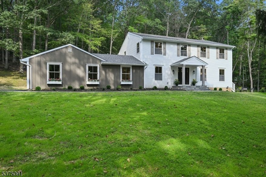 The perfect blend of modern design & timeless craftsmanship, 140 Hacklebarney is fully renovated & reimagined for 2025 by premier builder Abar Homes & Devinne Bravoco Designs. Care free living with Brand New Septic System, all new plumbing, electric, windows, HVAC, Hardi plank siding & roof. Set on 6.2 scenic acres in Chester Twp, the home offers 4 bedrooms, 3 bathrooms & over 3,700sqft of beautifully finished space w fully finished basement. The home stuns w custom trim & white oak hardwood floors throughout. The gourmet kitchen w top of the line SS appliances, waterfall island & dry bar sets the stage for dining or entertaining. Arched entryways lead to the formal dining room, while the family room showcases a wood-burning fireplace & custom built-ins. A 1st floor bedroom & full bath, private office, and mudroom off the 2-car garage offer flexibility for everyday living. Upstairs, the primary suite is a true retreat w WIC & spa-like ensuite bath w dual vanities & oversized shower. Spacious guest bedrooms & a stylish full bath complete the 2nd floor, along with the convenient upstairs laundry. Enjoy the finished basement for added living space & enjoy the serene outdoor escape on the expansive paver patio. Backing up to Hacklebarney State Park & just minutes from downtown Chester. Experience the finest in modern design & luxury living in one of NJ's most scenic locations!