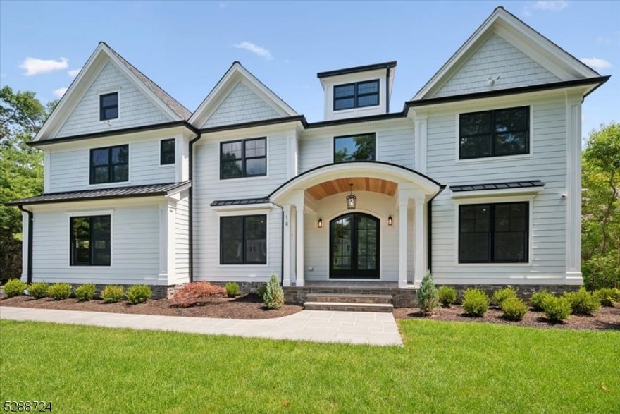 This stunning new construction residence sits on a sprawling 1-acre lot and boasts impeccable craftsmanship throughout. With 7 bedrooms, 6 full bathrooms, and 2 half baths spread across 4 levels, it offers ample space and luxury living. The kitchen features custom white oak cabinets and top-of-the-line stainless-steel appliances from Wolf, Sub-Zero, Fisher & Paykel, and Thermadore. A highlight is the exquisite dry bar with an ice machine and refrigerator, alongside a walk-in pantry with quartz countertops and a white oak butlers pantry with sink and dishwasher.  Additional features include custom white oak lockers in the mudroom and a first-floor bedroom with an ensuite bathroom.On the second floor, you'll find a refined primary bedroom with soaring 15-foot ceilings, a gas fireplace, and a cozy sitting area. Oversized Anderson windows flood the space with natural light. The primary bathroom is a sanctuary with heated floors, a soaking tub, a separate toilet closet, dual vanities, and a zero-entry shower. Ample closets abound, with a bonus room on the third floor and a spectacular lower level that includes a wellness room, another bedroom with a full bath, laundry hookups, a kitchenette, and a spacious recreation room.The flat level yard offers plenty of room for a pool, playground, and various outdoor activities.