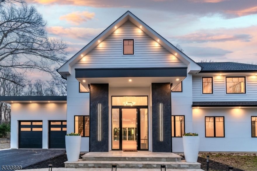 Custom New Construction. This newly constructed modern masterpiece begins with its luminous foyer with sweeping outdoor views and pristine white oak floors that extend throughout.A striking floating staircase with a sleek glass railing draws the eye up in the living room,  centered around a 72-inch electric fireplace. Telescoping dining room doors open to an elegant travertine patio that seamlessly blends indoor sophistication with outdoor serenity. The gourmet kitchen boasts a 10-by-4-foot waterfall island, quartzite counters, a full pantry, and high-end appliances. Additional spaces include a family room, a home office with bath, a finished lower level, two ancillary bedrooms, a guest suite with bath, and a grand main suite with a dressing room and spa-style bath, plus a finished third floor. Practicality meets luxury with two conveniently located laundry rooms, one on the first floor and one on the second. Here is a home with an uncompromising standard of design and craftsmanship. Don't miss it! Taxes to be determined when property is reassessed.