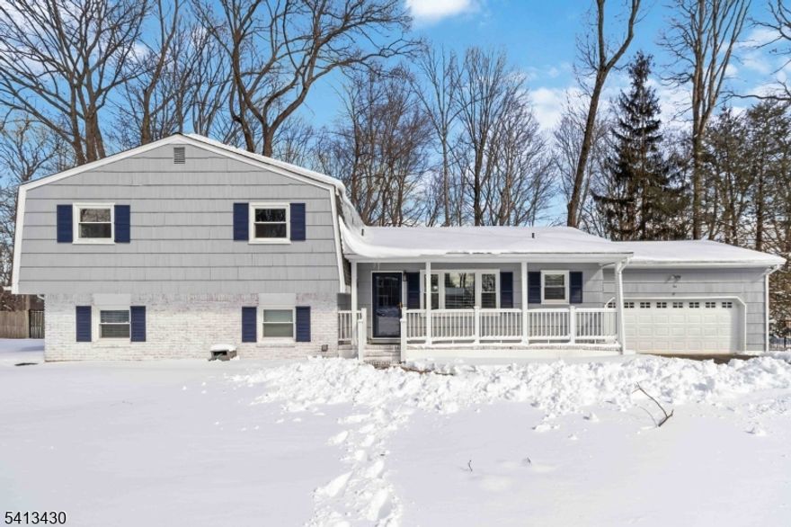 Spectacular updated sun filled 4 bedroom, 2 1/2 bath, expansive split nestled on a beautiful .58 acre level lot in the heart of Randolph. This move-in-ready, freshly painted home, BOAsts gleaming oak hardwood flrs thru-out the first and second level! Brand new showstopper kitchen features quartz countertops, stainless appliances, 5-burner gas range, breakfast bar and large walk-in pantry. Designed with an open layout, the formal living room features a large picture window and flows seamlessly into the dining room, with a second picture window for even more natural light. French doors off the kitchen lead to generous sized rear deck overlooking private backyard. Upstairs, the primary suite features a walk-in closet, additional double closet and beautifully updated en-suite w/double-sink vanity and custom walk-in shower. Two add'l spacious bedrooms offer ample closet space and share stunning updated main bath. The ground level includes 4th bedroom and supersized family room w/wood-burning fireplace, new flooring, plus laundry and updated powder room w/potential to convert to a full bath for in-law / guest suite.  A dry unfinished basement provides plenty of storage or future living space. Add'l highlights include full-house natural gas Generac generator, oversized 2 car garage, 2019 garage door w/electric opener, public water/sewer, natural gas heat, central air. Conveniently located near schools, parks, shopping, dining, and Morristown/Morris Plains. Welcome home!