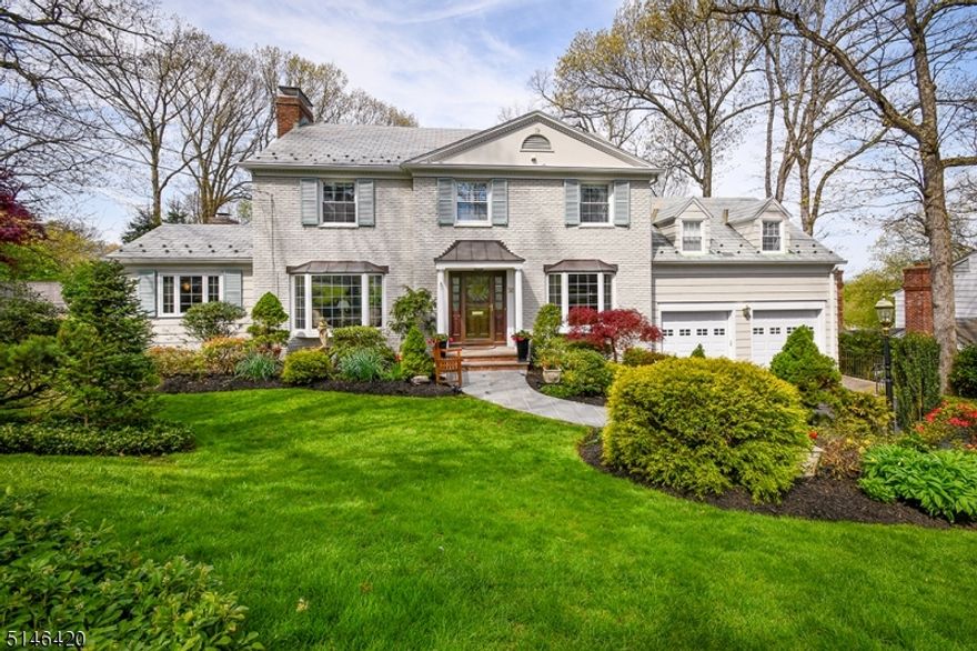 Classic 6 bedroom, 3.2 bth Woodland Park colonial in excellent renovated condition.  Family Room addition, beautiful home office, renovated custom kitchen, renovated marble primary bath, back staircase to guest or in law suite, fantastic lower level with rec room, game room, 6th bedroom or gym, full bath and tons of storage.  Beautiful rear property with 2 decks, a patio, extensive professional landscaping and amazing sunset views.  New since 2021: Main Zone CAC unit, new garage doors, new cement caps on both chimneys, new refrigerator.  Mint condition and move in ready!