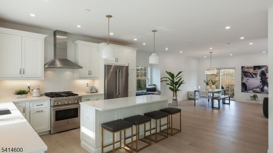 2023 End-Unit Townhome with Premium Upgrades in Parc North community built by Garden Homes! A perfect blend of modern style & functional design, this sun-drenched Jasmine model offers 2670 square feet of above grade living & an open layout w/ premium upgrades throughout. The heart of the home is a dramatic great room anchored by a gas fireplace framed by custom built-ins. The chef-inspired kitchen boasts white shaker cabinets, quartz countertops, a center island, upgraded designer lighting & a charming dining nook w/ custom banquet seating, offering direct access to a large rear patio for seamless indoor-outdoor entertaining.The upper level houses the primary suite featuring a dedicated sitting area, a spacious walk-in closet & double-vanity en-suite bath, plus two additional bright bedrooms, a hall bath, and convenient laundry. Distinguishing this home is a versatile street-level living area an entirely above-grade space currently used as a guest suite. This sun-filled, high-value footprint is a bright alternative to a traditional basement, providing the perfect space for a home office or gym.The 2-car garage is a hobbyist's dream, fully finished w/ a Tesla charger & custom slat wall storage. Additional highlights include custom electric blinds and a whole house water softener. Enjoy a maintenance-free lifestyle in Florham Park, minutes from top schools, dining, & commuting. A like-new, highly upgraded opportunity in a sold-out community a must-see!