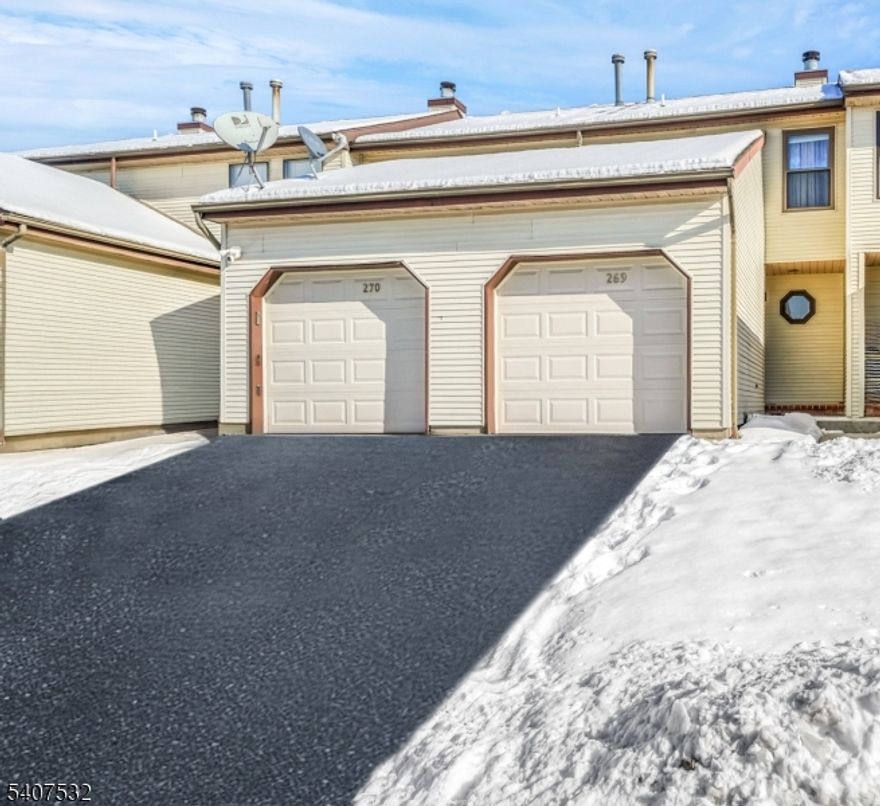 Welcome home to this meticulously maintained 2 bedroom/1.5-bathroom townhome in the sought after SunRidge community! Features include updated laminate floors throughout the first level, updated kitchen cabinets, new appliances, updated furnace and A/C, newer windows (tilt-in/easy-clean), new laminate floor in the second bedroom, and new carpet on the stairs and upper hallway.  The living room offers a cozy wood-burning fireplace, while the eat-in kitchen overlooks a private deck with a beautiful view from the updated Anderson sliding door. The primary bedroom features two large closets. Both bedrooms are spacious and have abundant sunlight. The full basement provides additional storage and a laundry area. Washer and dryer are included. Other conveniences include indoor access to the garage, first-floor powder room and pull-down attic access. Community amenities include a pool, playground, tennis courts, miles of walking paths, basketball courts, pickleball court, and a scenic pond. Located just minutes to shopping, dining, and local farm markets. Great schools and excellent location. Don't miss this beautiful move in ready home!