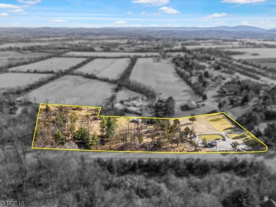 Discover the perfect canvas for your next chapter on this 6.36-acre property, offering a rare blend of space, privacy, and location. Whether you're envisioning a custom home, a peaceful retreat, or a lifestyle property, this land provides the flexibility and setting to bring your vision to life. The property includes a charming outbuilding/cabin for future creative potential, along with a farm stand that adds unique character and opens the door for hobby farming, local sales, or personal use.With plenty of room to design and build while still enjoying the natural surroundings. The acreage offers a serene, rural feel while remaining conveniently located near major routes, amenities, and nearby towns, making it an ideal balance of privacy and accessibility. Whether you're a builder, investor, or someone dreaming of creating a forever home, this property presents a rare opportunity to own substantial land in a highly desirable area.  A unique setting. Endless potential. An ideal place to build.