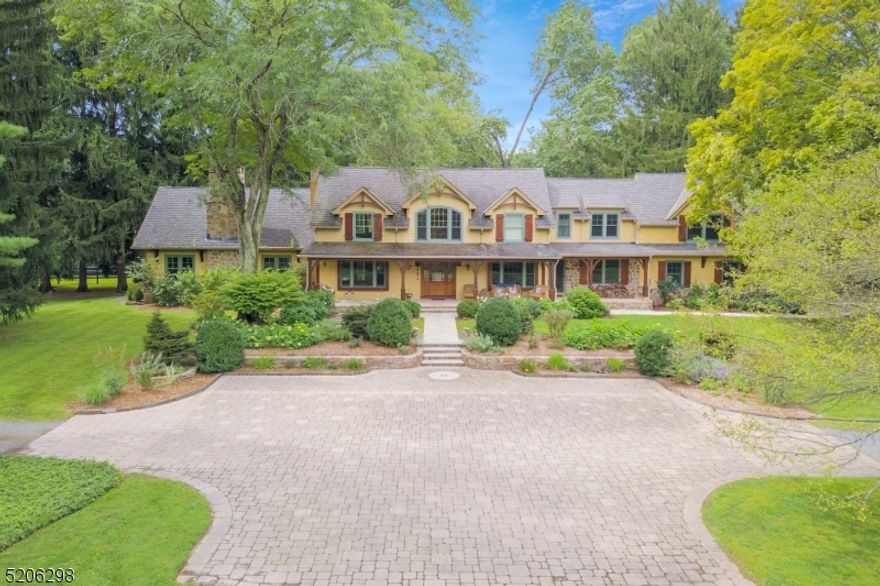 Jaw-dropping French Normandy design Custom Home with a top-to-bottom total renovation in 2006 is overflowing with wonderful artistic features including dramatic volume ceilings boasts over 6,630 sq ft of commodious living space on two sprawling floors, plus a sweeping rocking chair front veranda, sparkling free form in-ground swimming pool with magnificent pool house replete with full kitchen, expansive rear patio, 4 garages for car enthusiast, and a stunning professionally designed and maintained 5,99 acre showcase property- a truly unique and architecturally dynamic home that blends striking design, dramatic proportion, and natural elements in the most compelling of ways. Coveted, east Mendham Twp estate neighborhood set back perfectly with private gated driveway. 18 light-filled & spacious rooms including 5 airy bedrooms, 5.1 baths, soaring great room has a vaulted ceiling with exposed beams, radiant windows on 3 walls, & anchored by a commanding fireplace, gorgeous gourmet designer kitchen w custom cabinetry, over-sized center island, & resplendent clerestory windows, elegant open floor plan dining room is adjacent to the kitchen & has an open-hearth fireplace, handsome home office w adjoining "secret room", superb primary bedroom suite personifies elegance w romantic private balcony & 2 voluminous walk-in closets, sumptuous primary bath features a cathedral ceiling, jetted tub,& massive stall shower. This enthralling home has to be seen in person to be truly appreciated