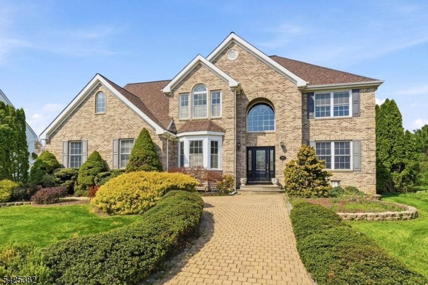 Discover this classic Colonial set in the peaceful and highly desirable community of Wyndham Farm. Nestled on a quiet residential street, this property offers an ideal blend of comfort, space, and suburban charm.This 3,848-square-foot home features a dramatic two-story foyer that opens to a formal living room and a private home office. The spacious eat-in kitchen showcases rich wood cabinetry, quartz countertops, a center island, and stainless steel appliances. Adjacent to the kitchen is a charming sunroom/play area with sliders leading to an expansive deck and pergola perfect for relaxing or entertaining while enjoying views of the lush grounds.The family room boasts vaulted ceilings, oversized windows that fill the space with natural light throughout the day, and a wood-burning fireplace. The 2nd floor features 4 bedrooms including a generously sized primary suite with oversized walk-in closets and a spa-like en-suite bathroom with two separate vanities, a walk in shower, and a soaking tub. Set on .89 acres of level, beautifully maintained property the outdoor space offers seamless access to the yard, deck, and pergola ideal for outdoor enjoyment and entertaining. The surrounding neighborhood provides a serene setting with convenient access to shopping, dining, major highways, and parks. Located near Routes 78 and 22, this home offers an easy commute while preserving the tranquility of Warren County living.