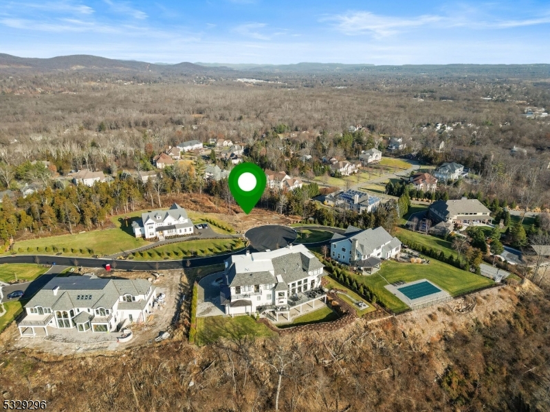 Discover the perfect opportunity to build your dream home on this premium vacant lot, ideally in a sought-after Montville neighborhood. Zoned for a single-family residence surrounded by custom luxury homes, this property offers a prestigious and tranquil setting with breathtaking mountain views to the north, serene valley vistas, and picturesque scenery that includes the prestigious Deer Run Golf & Pro Shop. The location is not only beautiful but also incredibly convenient just 3 minutes from Rails Steakhouse, the Towaco Train Station, and an easy commute to New York City via the Lakeland Route 46 commuter bus. With proximity to major highways, and a variety of dining, shopping, and recreational options, this is your chance to create the home and lifestyle you've always envisioned.