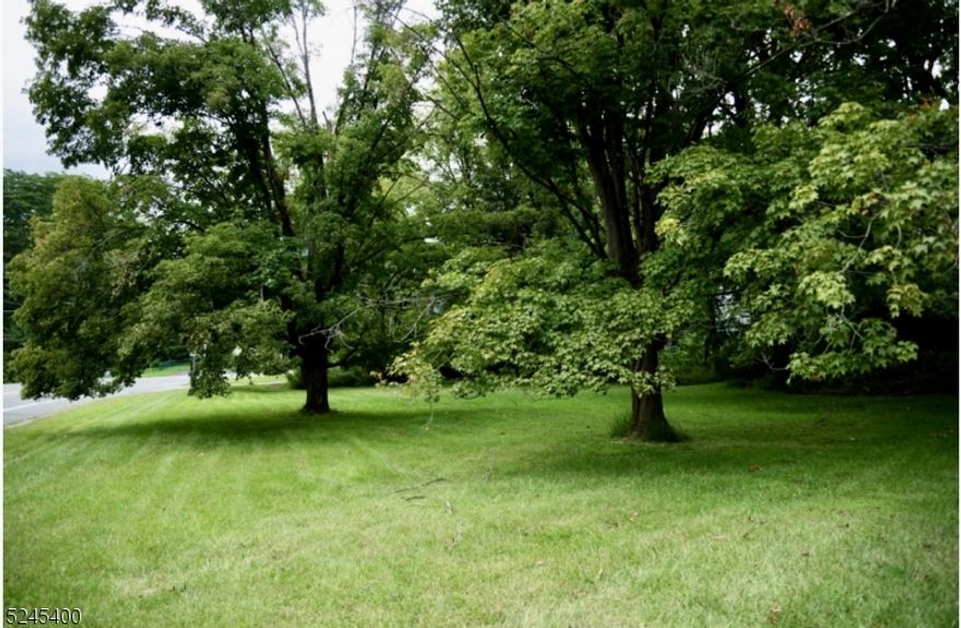 BUILDABLE Level and open lot.  Public Sewer at street! Quiet country living that is just minutes to all your shopping needs and quick highway access. End the search and build your own brand new home here!