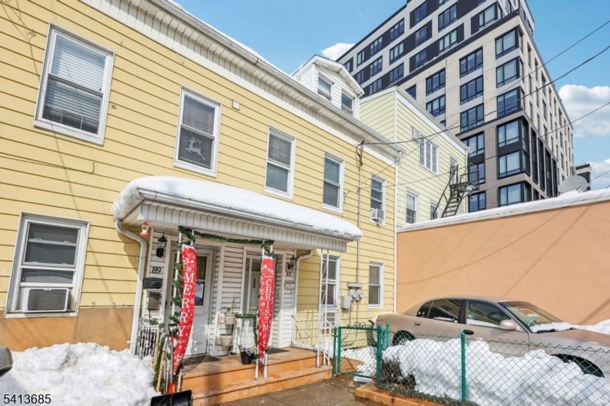 Welcome to 87 Union Street " A Commuter's Dream in the Heart of the Ironbound! Ideally located in the sought-after Ironbound section of Newark, this well-maintained, one-of-a-kind, attached two-family home offers unmatched convenience and lifestyle. Step outside your door and enjoy the vibrant energy of Ferry Street's renowned restaurants, Shoppings  and neighborhood amenities. This prime location is just one block from Newark Penn Station, providing an easy NYC commute approximately 20 minutes by train. Nearby attractions include the Prudential Center, the New Jersey Performing Arts Center, Whole Foods Market, and the Newark Museum of Art, as well as recreational parks, major highways, and public transportation. The property features a first-floor unit with two spacious bedrooms, hardwood floors, and two full bathrooms. Second-floor unit: Six rooms including two bedrooms, one full bathroom, and ample closet space. Unfinished basement with additional potential. Concrete driveway with parking for one car. Whether you're an owner-occupant or an investor, property offers an outstanding opportunity to live or invest in one of Newark's most vibrant and thriving communities.Don't miss this exceptional Ironbound opportunity!