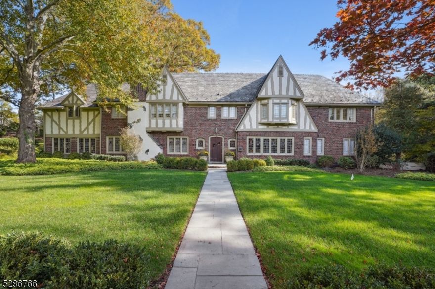 Rarely does a property come to market that melds the rich heritage of Old Short Hills & the ultimate in modern form & function. This magnificent 5 bedrooms, 4 full & 3 half bathrooms masterpiece, situated in the prestigious Woodfield Estates Section, meticulously renovated & reimagined to meet today's updated wants & needs. The home seamlessly blends original architectural details with impeccable contemporary features & comforts. The home boasts breathtaking historic stained glass windows, exquisite handcrafted plaster ceilings & moldings, intricate millwork throughout, stunning imported French limestone fireplace & much more. Entertaining is effortless in the spacious living room, dining room and sunroom. The thoroughly modernized & expanded open plan kitchen adjoins a breakfast room & spacious family room providing the ideal setting for day to day life. Glass French doors & oversized picture windows brings the outdoors in & leads to to the serene saltwater swimming pool & custom bluestone patio, perfect for relaxation & social gatherings. Working from home is a pleasure in the custom-designed, floor to ceiling mahogany office with wet bar & mahogany built-ins. This gorgeous home exhibits majestic charm with modern amenities. From the meticulous interior spaces to a timeless brick & stucco exterior & Vermont slate roof, every detail reflects unparalleled quality & craftsmanship. Professionally landscaped front & back yards, close to major highways & train stations to NYC.