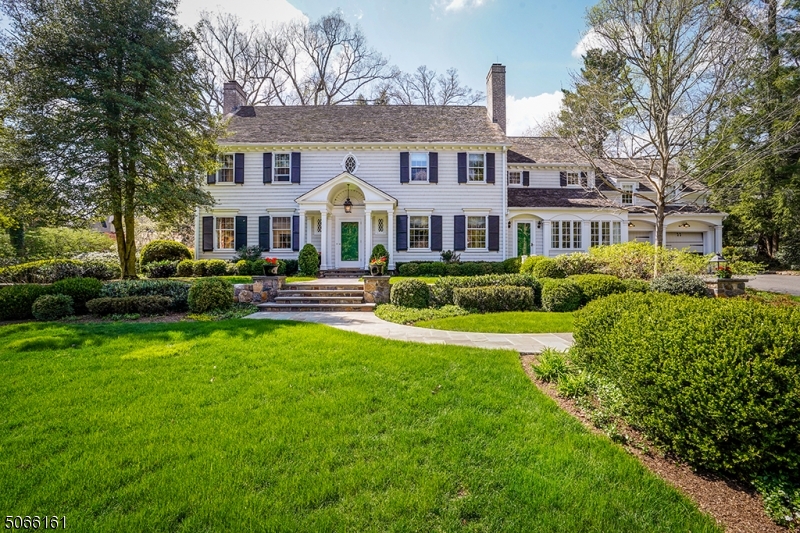 A rare opportunity to own this classic 1927 Colonial on Summit's prestigious Northside, offering both exceptional convenience and privacy. Walk to town, train and schools from this stunning 5/6 bedroom, 4.3 bath home with spacious living and dining areas complimented by cozy spaces for work and relaxation.  Large white kitchen with adjacent breakfast room, mudroom, home office and sunroom.  A huge lower level includes a 2nd family room/playroom, gym, wine cellar, laundry and three additional rooms for endless possibilities.  Featuring 1.2 acres with lovely bluestone patios, rolling lawns and a matching "Little House," this home is truly a unique Summit property