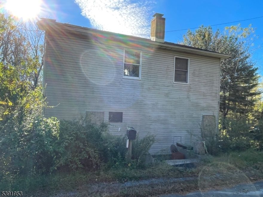 CASH or RENOVATION LOAN ONLY.....Being SOLD 100% AS-IS. Complete renovation needed. Fire from two years ago. Amazing potential from a previous 2500 ft.² four bed 2 1/2 bath colonial home with full basement Seated on just over 2 1/2 acres. There is a second structure on the building as well as a six car detached garage that is not visible from the road. There is a large hole where there was once previously a pool. This is an investor special or a LARGE project for someone who cannot currently find something they like on the market and has the vision to turn it into their dream home.  This is not for the faint of heart, but for those brave people who like taking on large projects.  Essentially, this is a blank canvas so you get input on every decision to make it into your perfect home.