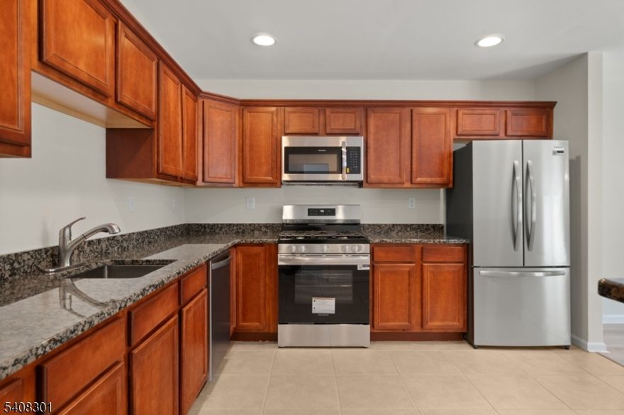 Walk Right into this updated townhome in Ridgefield Commons in Hardyston. This open floor plan offers 3 bedrooms and 2.5 bathrooms with new flooring seamlessly throughout the main living area and all 3 bedrooms. The kitchen features granite countertops, a breakfast bar, and new appliances, perfect for everyday living and entertainment. Upstairs includes a primary bedroom with en-suite bath, two additional bedrooms, a full bath, and second-floor laundry room!. Conveniently located minutes from the Sussex County YMCA, Crystal Springs Golf Resort, and Mountain Creek Ski Area, offering four seasons of recreation right outside your door.