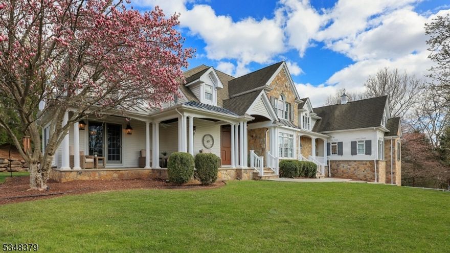 Welcome to this stunning custom country estate offering resort-style living at its finest. Nestled on a quiet, tree-lined cul-de-sac, this beautifully crafted five-bedroom home boasts exceptional architectural details, including intricate moldings and gleaming hardwood floors. The main level features a sunken living room, formal dining room, and private home office with a fireplace and French doors leading to a covered porch. The gourmet kitchen is a chef's dream with custom glazed cabinetry, granite countertops, high-end stainless steel appliances, a center island, and a large eat-in area with French doors opening to a rear stone patio. The expansive family room includes a wood-burning fireplace, vaulted beamed ceilings, and access to a covered patio with its own fireplace ideal for year-round entertaining. A first-floor bedroom with full bath, game room with wet bar, and laundry room add functionality. Upstairs, the luxurious primary suite offers vaulted ceilings, a sitting room with gas fireplace, dual walk-in closets, and a spa-like bath with sunken Jacuzzi and oversized shower. Additional en-suite bedrooms and a spacious fifth bedroom offer comfort for guests. Outside, enjoy an inground heated pool, hot tub, stone patios, and lush landscaping. With close proximity to town, top-rated schools, and NJ Transit, this exceptional home blends luxury, comfort, and convenience. Move right in!