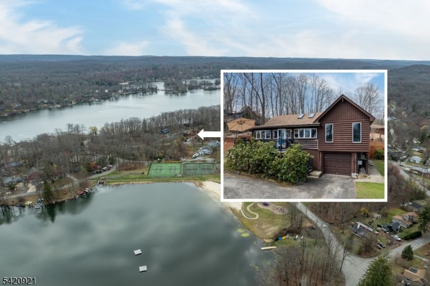 Set in the heart of Highland Lakes, this classic 1936 log cabin offers the kind of lake community lifestyle people dream about, with the clubhouse, boat docks, two sandy beaches, tennis courts, playground, softball field and more, all a stone throw away! From the front of the home, enjoy views of Highland Lake that remind you how close the water and all the fun really are. Inside, the main living level blends vintage charm with comfortable everyday living. You'll find a welcoming living room, kitchen, three bedrooms, two full baths, and a dining room currently being used as an additional bedroom, offering flexibility for guests, work-from-home needs, or extra sleeping space. Downstairs another finished bonus room adjoins the unfinished basement with laundry, mechanicals and the one car garage.  The home's character is complemented by bright, inviting rooms and thoughtful updates that make it easy to settle in and enjoy. A whole house generator and split units for heating and cooling in each of the three bedrooms as well as baseboard oil heat (newer Roth Tank) throughout give so much peace of mind! Andersen windows enhance both style and efficiency. NEW 2025 SEPTIC!!! Whether you're looking for a full-time home, weekend getaway, or year-round retreat near the lake, this Highland Lakes cabin offers charm, convenience, and a setting that makes every day feel a little more like vacation.