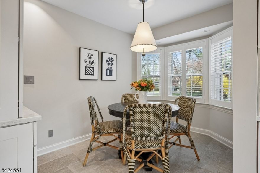 Set on a desirable tree-lined street in the prestigious Madison Hill section, this beautifully updated Colonial is a true gem offering charm and exceptional curb appeal! Featuring 5 bedrooms and 4.1 baths, the home features gleaming hardwood floors and abundant natural light throughout. The spacious living room boasts a bay window and gas fireplace, creating a warm, inviting atmosphere. A large family room with outside access provides seamless indoor-outdoor living, while the formal dining room is perfect for entertaining. The newly custom-renovated kitchen with breakfast room is a standout, and a first-floor office offers ideal work-from-home flexibility. The second level boasts three bedrooms and two full baths, including a spacious primary suite with en suite bath and walk-in closet. A private guest suite above the garage, accessed by a rear staircase, features its own bedroom and en suite bath perfect for visitors or extended stays. The third floor houses a spacious fifth bedroom with an additional en suite bath. Additional features include a screened in porch, two-car garage, a private fully-fenced backyard with perennial gardens and mature plantings, a paver patio ideal for outdoor entertaining, along with much more! Just blocks to town and NYC trains, this exceptional property combines classic charm, generous space, and an unbeatable location!