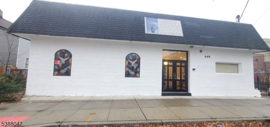 Location! Location! Location! Beautiful spacious Commercial building/House of Worship seated on the border of Orange and West Orange, NJ nestled in a quiet residential arts district of Orange. Welcome to this chandelier lite inviting entrance leading to a raise stage at the front of the sanctuary overlooking an open floor plan with seating able to hold at least 130+ parishioners. The sound room is located at the rear of the sanctuary. The freshly painted large event/dining space located in the rear of the building can hold another 100+ people and has 15 feet ceilings, a separate kitchen area and multiple safety exits. There are two private office spaces available: secretarial office upfront and the other large office is located at the far end of the building providing cozy office space with a half bathroom. There are two separate male and female bathrooms. The basement space is large and useful for storage.