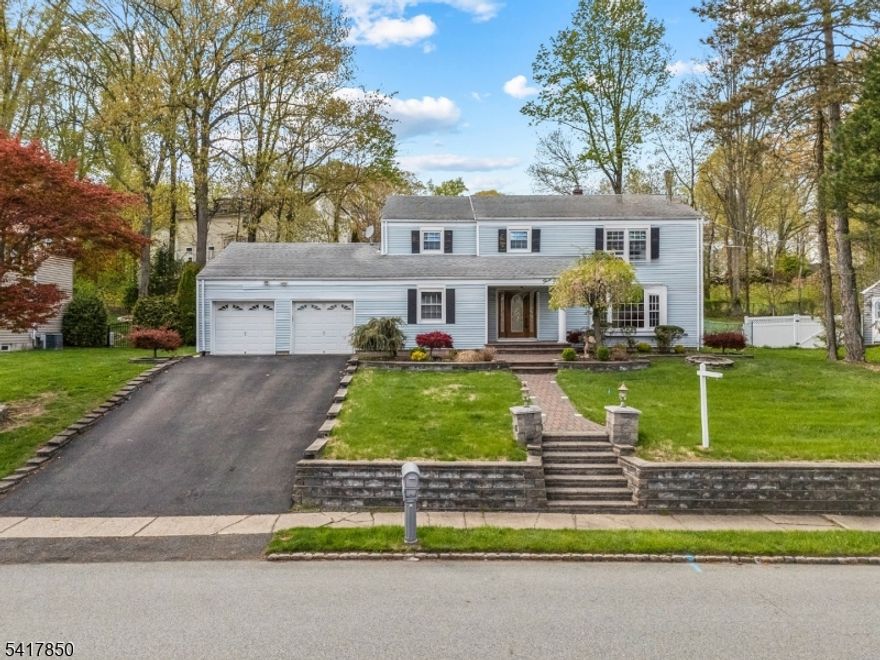 IMMACULATE and SUN DRENCHED!  FRESHLY PAINTED and WELL MAINTAINED! Nestled on over 1/3 acre, this Sun-filled Colonial is sure to impress! Step inside to the main level to be greeted by a welcoming foyer, where you'll find an expansive living room, a formal dining room, a well appointed kitchen with center island, a convenient family room, a den/office, powder room, and laundry room. Upper Level features a spacious primary suite with a walk in closet and lovely full bath. Three additional generous sized bedrooms and a full bath completes this level. Basement level offers a versatile recreation room and a utility room with plenty of storage space. Enjoy seamless indoor-outdoor living with multiple access leading to a large, inviting paver patio and backyard! (PARSIPPANY WITH BOONTON MAILING ADDRESS) DO NOT MISS THE OPPORTUNITY TO MAKE THIS HOUSE YOUR HOME!