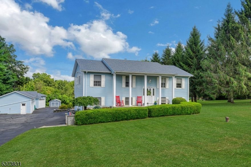 Welcome to this beautifully updated custom home with an abundance of amenities. Enjoy country living surrounded by historic towns, lakes, hiking and ski resorts! This home has a large, manicured lot, mature garden and  beautiful inground heated pool (recent pool surround and liner redo). The outdoor kitchen and oversized deck add to the feel of resort living!Among the unique features, a four bay garage with lift as well as an additional out building! 4/5 bedrooms, 3 1/2 baths, freshly painted, hardwood and ceramic floors, cathedral ceiling,front and rear indoor staircases, newer stainless appliances, gas range as well as a water treatment system. Ground floor level fully renovated and serves as an additional living suite..lower level boasts a newly added country gas stove for cozy cooler days! Newer central air unit (2021), Newer furnace (2020) and recent garage reno painted floors, painted walls, new doors and openers) This homes exudes Pride of Ownership!