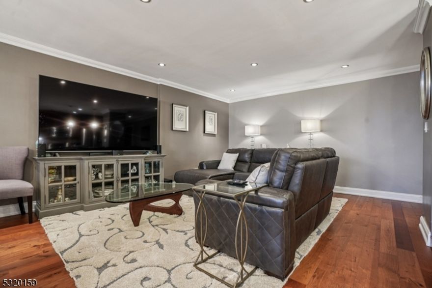 Discover luxury, comfort, style, and convenience in this beautifully appointed penthouse 2-bedroom, 2-bathroom condo with higher ceilings with recessed lighting at the coveted Executive House in Hackensack. Perfectly situated in the heart of Hackensack, this sun-drenched residence features a spacious open layout with walls of windows, flooding the home with natural light and offering stunning views, including glimpses of NYC, from your private terrace, often including rainbows. The modern kitchen is equipped with stainless steel appliances, granite countertops and abundant cabinet space ideal for both everyday living and entertaining, plus a breakfast island and/or bar area. Both bedrooms offer generous proportions, and the bathrooms are tastefully updated with contemporary finishes; one bedroom includes a unique washer/dryer for your convenience. Enjoy resort-style amenities in a serene, park-like setting spanning 3.7 acres. The Executive House offers; 24-hour concierge & doorman service, secure package handling, as well as in ground swimming pool, private park, on-site building management and storage unit; 1 outside parking space ($) & overnight guest parking. HOA includes heat, electric and water, dramatically reducing your utility costs. Centrally located just minutes from NYC trains, major highways, shopping, and NYC-bus on corner, this is luxury, lifestyle, and location all in one.  A deeded one-car parking spot in the garage is also available for separate purchase.