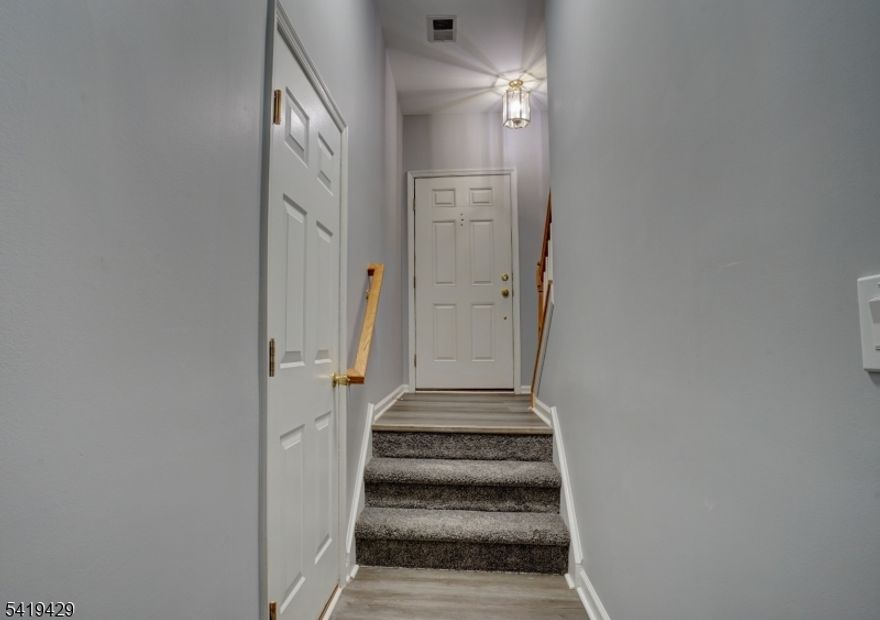 Wow, be the first to live in this totally renovated home. This large 3 floor unit with garage has been transformed. Walk-in entry way with garage access, stairs to daylight basement and stairs to main living area. Upstairs the new kitchen has beautiful white cabinets with granite and stainless steel appliances, gorgeous. There is an also large panty. The kitchen is open to the dining and living room, all with new flooring. The hall half bath is located on this floor and has beautiful tile and cabinet. On the 3rd floor there are 2 good sized bedrooms and 2 full baths. Everything is new, even the door hardware! The primary has an en-suite with a walk in shower. There is a large walk-in closet and tray ceiling. The full hall bath serves the second bedroom. Laundry is also on this level.Totally updated from top to bottom and freshly painted, this rental is a standout and must see. Conveniently located to NJ Transit train at the bottom of the hill, Close proximity to Routes 22,31, 78 and 287. Many restaurants, shopping recreation local.