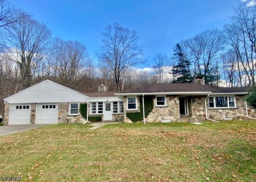 Nestled on a beautiful, level 3.92-acre lot that blends open yard with wooded privacy backing up to State Land, this home combines character with modern convenience. Welcome to 1668 Route 565, a classic Sussex ranch offering peaceful country living with thoughtful updates and plenty of space to grow. Step inside to discover a warm and inviting layout anchored by a cozy living room with a Stone Hearth Fireplace, perfect for relaxing evenings and gatherings. The heart of the home is the updated Kitchen, where new flooring adds fresh style and durability, opening easily to casual dining and scenic views. This classic ranch features 3 bedrooms and 1.5 baths - comfortable spaces with great potential, New water heater (2024), Updated kitchen with new flooring, Washer and dryer about 4 years old, Oversized 2-car attached garage, connected by a Workshop and 3 season Porch with Wood Burning Fireplace, Full, walk-out unfinished basement with room for expansion, Private deck/patio and dog run ideal for outdoor enjoyment. Expansive yard - plenty of room to garden, play, or create outdoor living spaces. Set on a quiet country road yet close to Sussex area amenities, this property offers the perfect blend of peaceful rural charm and everyday practicality. Property can be subdivided. Whether you're looking to make it your forever home or bring your own updates and vision to life, this Sussex ranch is brimming with potential and ready for its next chapter.