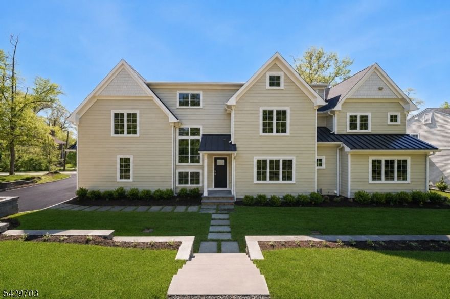 Experience the pinnacle of luxury in this new construction masterpiece by Singer Properties. Spanning four finished levels, this 6BR, 6.1BA home features an open-concept floor plan accented by wide-plank white oak floors and designer finishes. The gourmet kitchen is a showstopper with Taj Mahal quartzite counters, slab backsplash, and professional Thermador appliances. The first floor includes a guest suite, well appointed mudroom, and built-in speakers for seamless entertaining. Upstairs, the primary retreat offers dual walk-in closets and a spa-like bath, while the third-floor loft and finished basement provide ample bonus space for recreation, or a home office. Built for modern living, the home features a 2-car on-grade garage, and is pre-wired for a backup generator. The exterior is a private oasis with custom landscaping and an elegant bluestone  patio and walkways.Ideally located between minutes from Downtown Millburn, steps from the Midtown Direct train, Top Rated Wyoming Elementary School, and South Mountain Reservation. This is a rare opportunity to own a home in Millburn's most sought-after location.