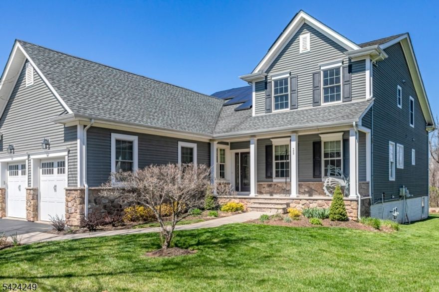 Experience the best of 55+ living in this expanded Bridgeford model, situated on one of Tapestry at Montgomery's largest and most desirable lots. Perfectly positioned directly across from the clubhouse, pool, and tennis courts, this home offers immediate access to community amenities while maintaining a sense of quiet seclusion. The bright interior is thoughtfully designed for both comfort and functionality. The front entry is flanked by living and dining rooms perfect for formal entertaining. A granite-clad kitchen, with generous cabinetry and a center island, serves as the heart of the home; it opens to the spacious family room featuring vaulted ceiling, gas fireplace, custom built-ins, surround sound and sliders that lead out to a private paver patio. This outdoor space provides a peaceful retreat with views of mature trees and a tranquil bio-basin, offering a level of privacy rarely found in the community.  The first-floor primary suite features dual walk-in closets, a spa-like en-suite bath, and laundry. Upstairs, a versatile custom loft with built-in cabinetry provides the ideal home office or library, accompanied by two additional bedrooms and a full bath for guests. Practical highlights include a two-car garage, full daylight basement, a new HVAC system, and energy-efficient solar panels. Located just minutes from Princeton and the new Montgomery Promenade (openings scheduled for summer), this home combines sophisticated comfort with a premier Skillman location.