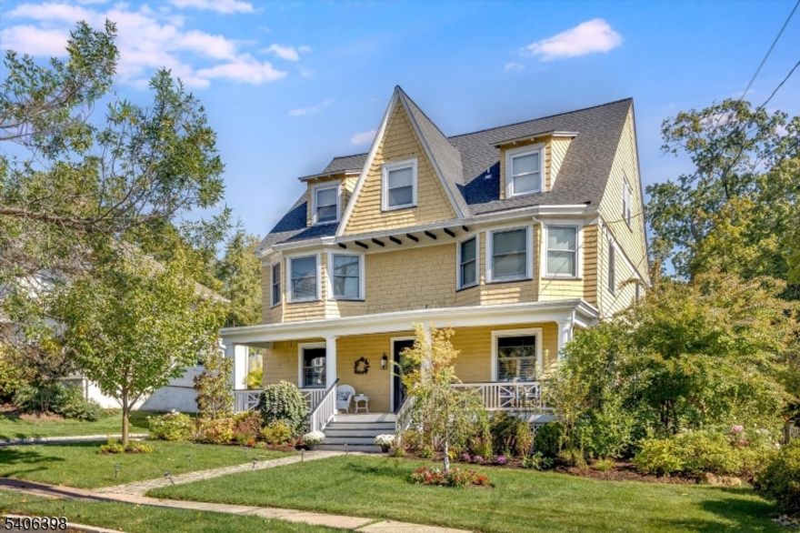 Set on one of Maplewood's most desired streets, this stunning Colonial with Victorian elegance delivers architectural integrity, elevated modern updates, and an exceptional village lifestyle. A welcoming front porch, sunny exterior, and classic curb appeal create an immediate sense of warmth & charm. Inside, a flowing floorplan of gracious, light-filled rooms showcases fine period details paired with thoughtful contemporary upgrades. The chef's kitchen is a true centerpiece, featuring stone countertops, a Wolf cooktop, double wall ovens, SubZero refrigeration, two Miele dishwashers, walk-in pantry, eat-in island, and a custom built-in wine bar with cooler. The kitchen opens seamlessly to dining, living, and family rooms, making daily living and entertaining effortless. Upstairs, five private bedrooms and two full baths include a serene primary en-suite. The incredibly expansive third-fl Great Room offers flexible space for work, play, or relaxation, while a finished basement adds room for a gym, studio, or recreation. Outdoors, a deeply private backyard OASIS awaits, anchored by a garage-turned-cozy escape, a luxury patio with heaters, gas fireplace, outdoor kitchen, and TV for year-round enjoyment. Smart home systems, multi-zone HVAC with filtration, security, and premium finishes complete the offering. Just 2 blocks from Maplewood Village shops, restaurants, NYC trains, and South Mountain Reservation trails, this is a home where design, comfort, and community come together!